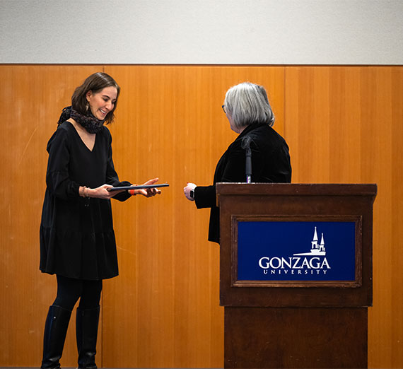 Brenna Messner sitting in nursing lab looking away from the camera.
